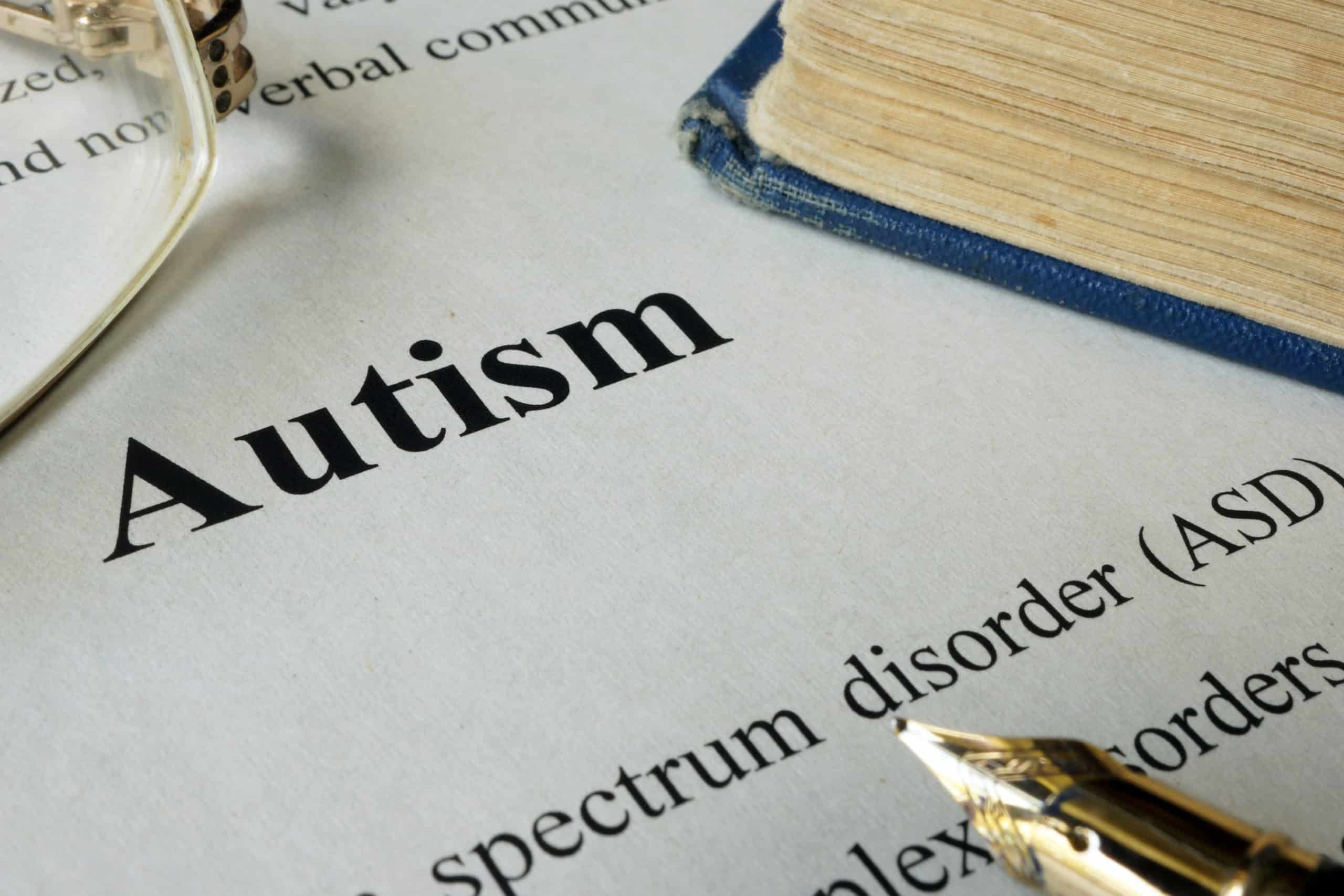 Autism spectrum disorder ASD written on a paper. what is autism
