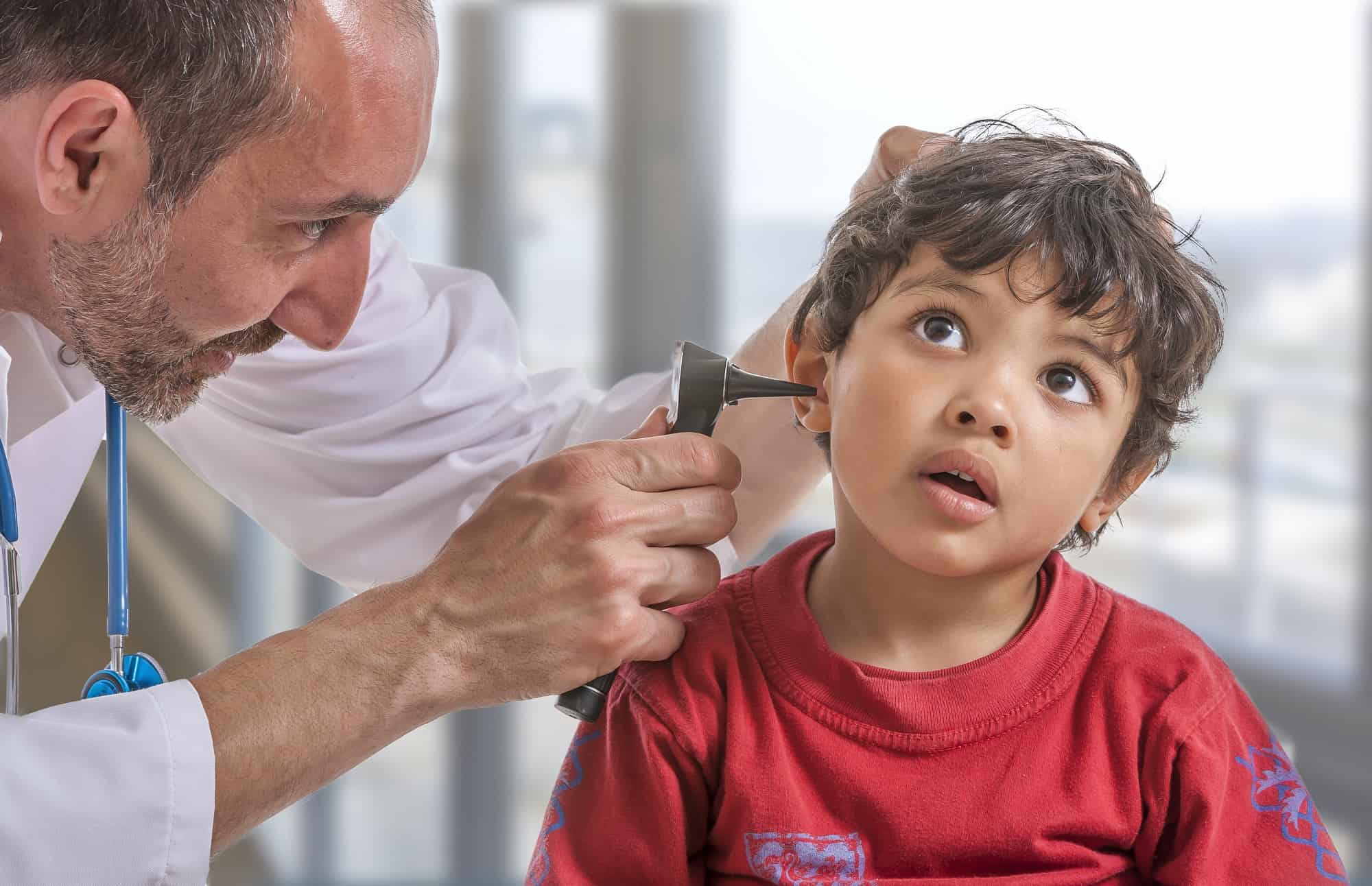ENT medical examination with the otoscope, in one child boy autism medical, autism care