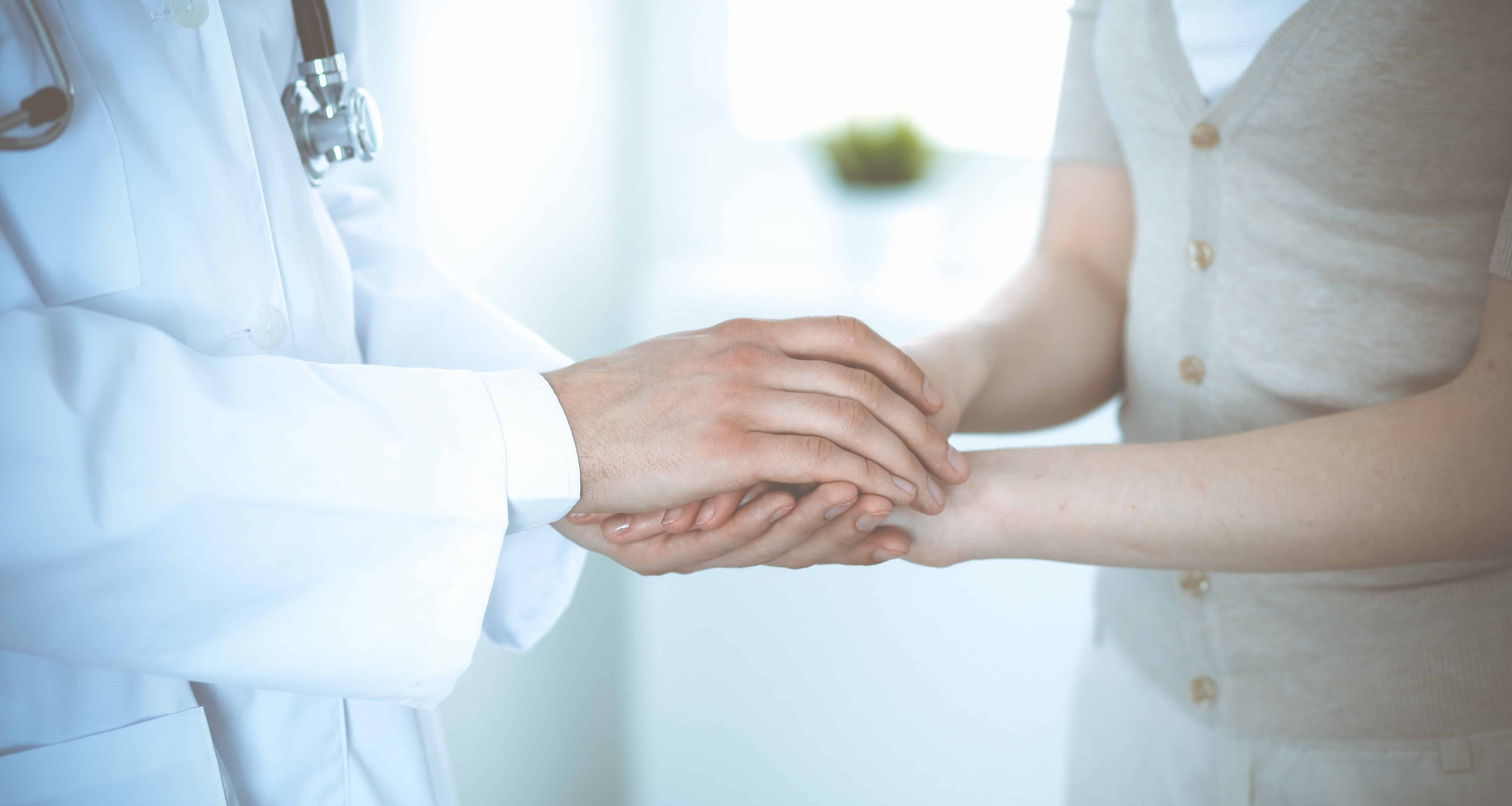 Hand of doctor reassuring her female patient. Medicine and health care concept autism medical, autism care