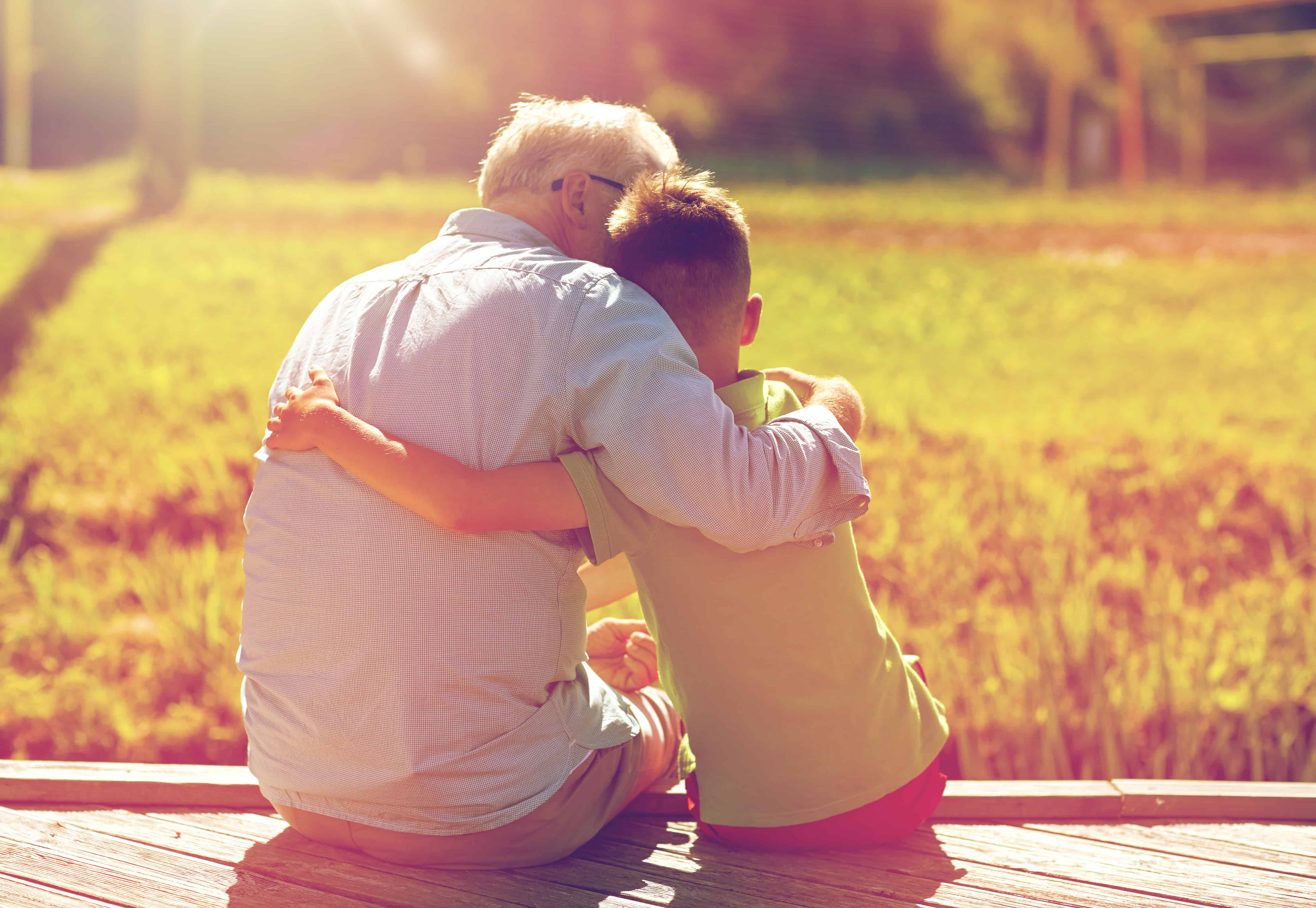 grandfather and grandson hugging on berth autism help friends and family